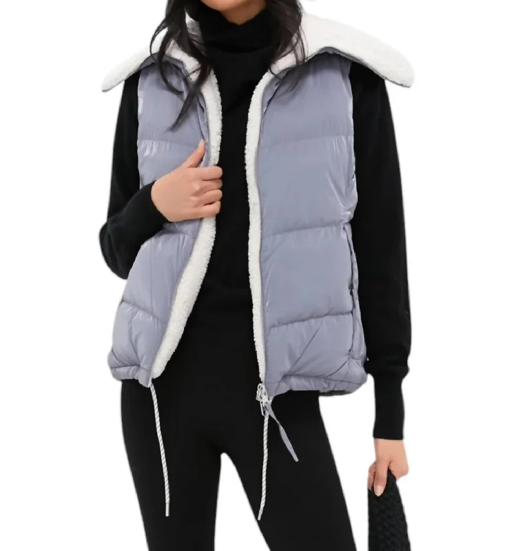 vegan women's coats (fur-free options)Brock Puffer Gilet In Blue Wind